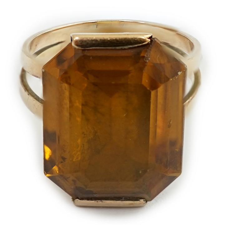 A mid to late 20th century gold and single stone octagonal cut synthetic? sapphire set dress ring, size P, gross weight 6.8 grams. Condition - poor to fair